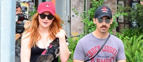 Sophie Turner and Joe Jonas (shown with adopted husky) are now engaged according to their Sunday announcement. | Credit (E! News/YouTube)
