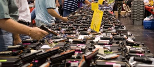 Customers shop for guns at a past gun show in Houston.[image credit - M&R Glasgow/flikr.com]