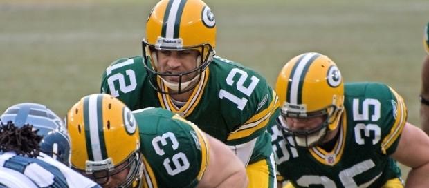 Aaron Rodgers (#12 above) of the Green Bay Packers (Wikimedia/Mike Morbeck) Aaron Rodgers (#12 above) of the Green Bay Packers (Wikimedia/Mike Morbeck)