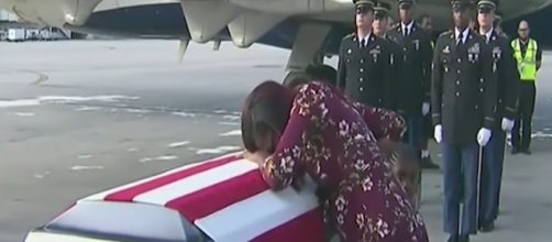 The widow of Sgt. La David T. Johnson gets emotional as her husband's body returns home - Image via YouTube screenshot