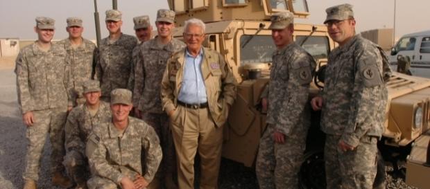 Easy Company WWII veteran Donald Malarkey visiting US troops in Iraq, 2008. (Photo Credit: Charles Mekin/Wikimedia Commons) Easy Company WWII veteran Donald Malarkey visiting US troops in Iraq, 2008. (Photo Credit: Charles Mekin/Wikimedia Commons)