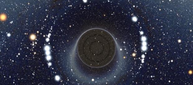 An illustration of a Wormhole is space. (via Alain r/Wikimedia Commons) An illustration of a Wormhole is space. (via Alain r/Wikimedia Commons)