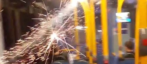 Youths in London threw a lit firework into a bus, causing panic among passengers [Image credit: Apostolos/YouTube]