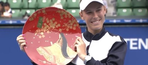 Caroline Wozniacki with her 2017 Tokyo trophy; (Image Credit: WTA official channel/YouTube)