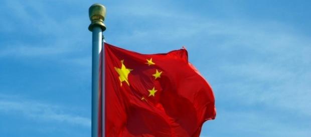 Chinese flag waving in Tian An Men Square, Beijing, on a sunny day. Image Elisa Tirabassi Chinese flag waving in Tian An Men Square, Beijing, on a sunny day. Image Elisa Tirabassi