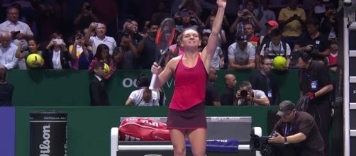 Simona Halep celebrating her win over Caroline Garcia in Singapore/ Photo: screenshot via WTA channel on YouTube