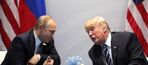 Vladimir Putin and Donald Trump at the 2017 G-20 Hamburg Summit (Photo via: [Wikimedia Commons]).