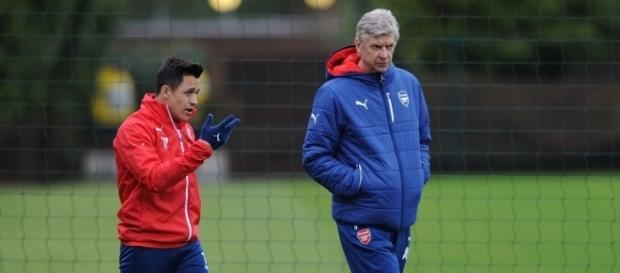 Arsenal striker, Alexis Sanchez (Left) walks with the team manager, Arsene Wenger during a past training. (Image Credit: Emrah Partal/Flickr) Arsenal striker, Alexis Sanchez (Left) walks with the team manager, Arsene Wenger during a past training. (Image Credit: Emrah Partal/Flickr)