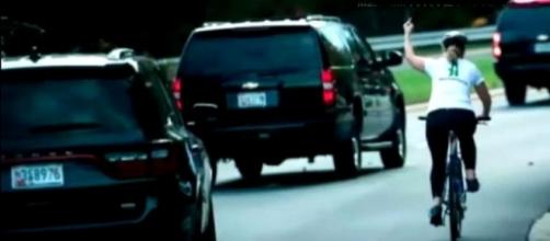 A female cyclist was seen to give Donald Trump the middle finger in Virginia. [Image credit: MARYY Official/YouTube]