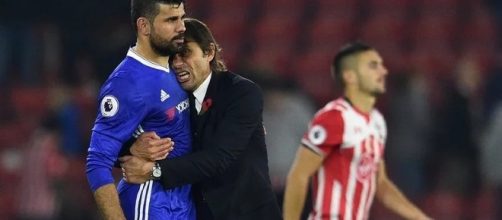 Chelsea manager Antonio Conte hugs Diego Costa in a past match. [Image via Mbah Patrick/Flickr]