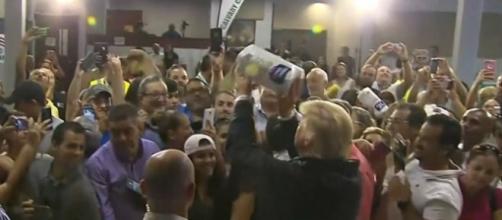 Donald Trump defended his choice of throwing paper towels to hurricane survivors in Puerto Rico, "it was fun" [Image credit: RT/YouTube]