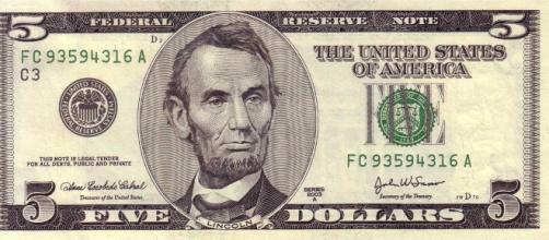 The United States economy is looking up [File:5dollarbill.jpg - Wikimedia Commons - wikimedia.org]