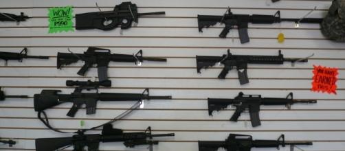 Semi and fully automatic rifles available for use at a gun range [Image - Corey Doctorow via Wikimedia Commons]