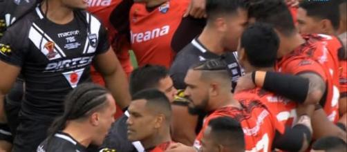 New Zealand players square up to the Tongans at the end of their infamous Haka display - thesun.co.uk