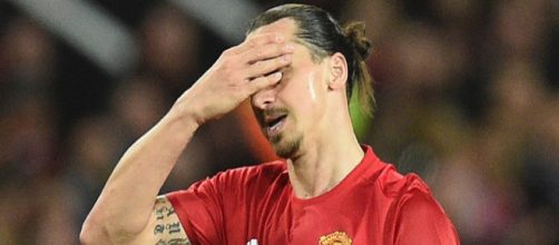 Manchester United striker Zlatan Ibrahimovic covers his face to show his frustration in a past match. (Image Credit: Cs2Kaisar Judi/Flickr)