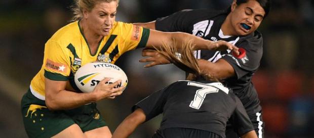 Australia captain Ruan Sims fends off two New Zealand players. Image Source: abc.net.au Australia captain Ruan Sims fends off two New Zealand players. Image Source: abc.net.au