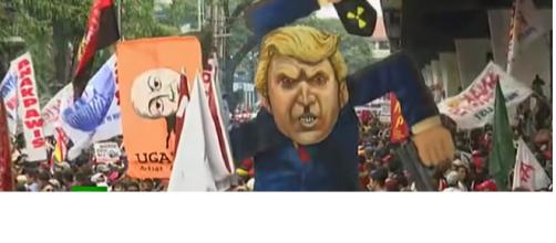 Protesters burn effigy of Donald Trump in Manila. [Photo:RT/YouTube]