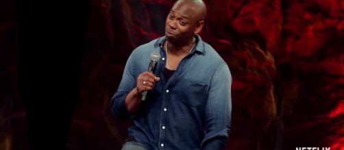 Dave Chappelle is touring around the country and being funny. [ Netflix/Youtube screencaps ]