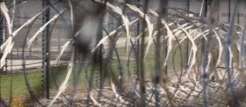 Razor wire surrounding prison. - [mage from Al Jazeera English/YouTube]