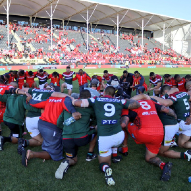 Lebanon and Tonga meet in prayer following the latter's 24-22 victory in last weekend's quarter-finals. Image Source: Twitter (@LebanonRL).