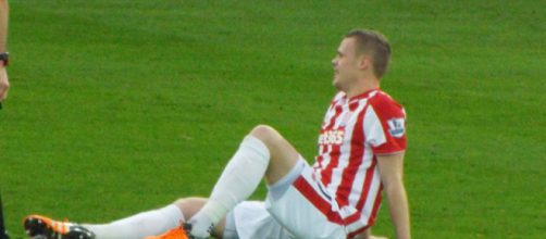 Stoke City captain Ryan Shawcross goes down with an injury in a past match. (Image Credit: Ian Johnson/Flickr)