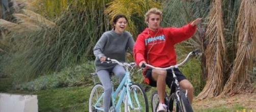 Selena Gomez and Justin Bieber enjoying a bike ride. (Image from RichFiles/YouTube)