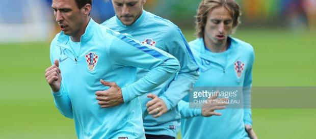 Croatia's forward Mario Mandzukic and midfielders Ivan Rakitic and ... - gettyimages.com Croatia's forward Mario Mandzukic and midfielders Ivan Rakitic and ... - gettyimages.com