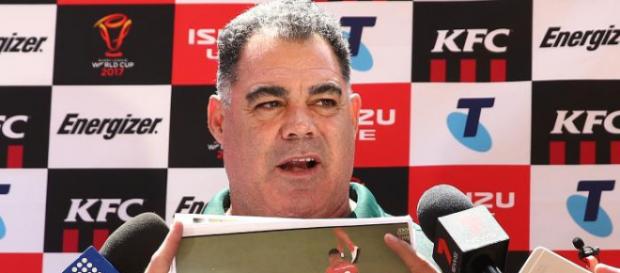 Australia coach Mal Meninga shows photos to media before an Australian Kangaroos training session at Suncorp Stadium. Source: Getty Images Australia coach Mal Meninga shows photos to media before an Australian Kangaroos training session at Suncorp Stadium. Source: Getty Images