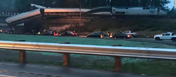 Photo of the derailed Amtrak 501 that dangles over Interstate 5. - CNN Photo of the derailed Amtrak 501 that dangles over Interstate 5. - CNN