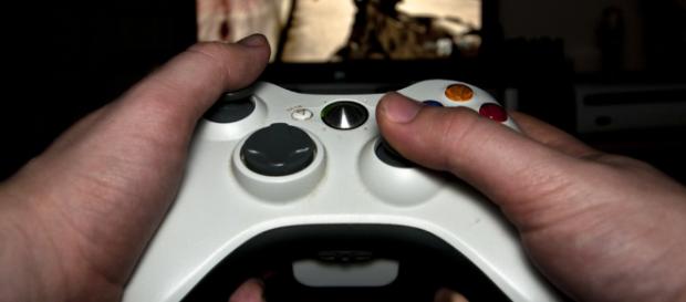 A person playing a game -- Luke Hayfield/Flickr. A person playing a game -- Luke Hayfield/Flickr.