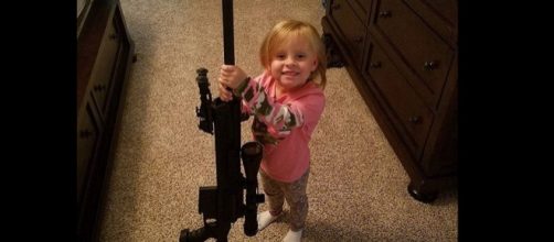 Adalynn Faith Calvert poses with a gun. [Photo via Instagram]