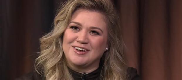 Grammy Award winner Kelly Clarkson is back with a new record called "Meaning of Life." (Image Credit: ET Canada/YouTube screencap) Grammy Award winner Kelly Clarkson is back with a new record called "Meaning of Life." (Image Credit: ET Canada/YouTube screencap)