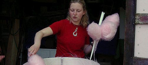Woman spinning cotton candy. - [Image: Cotton Candy Lady/flickr.com]