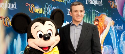 Bob Iger, chairman and CEO of The Walt Disney Co., and Mickey Mouse [Image Credit: Jagadish/Wikimedia Commons]