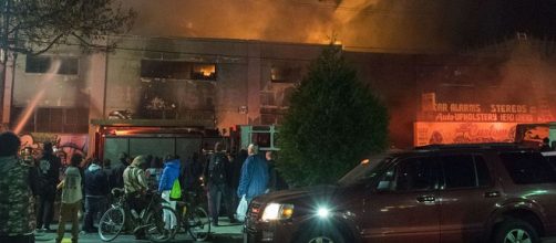 Evacuees watch Oakland firefighters battle flames at the Ghost Ship warehouse where 36 died in 2016. - [Photo: Julianna Brown/Wikimedia Commons]