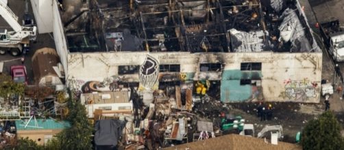Debris can be seen outside the fire-ravaged Ghost Ship live/work warehouse in Oakland, Calif., where 36 died n December blaze. (Photo: The Columbian)