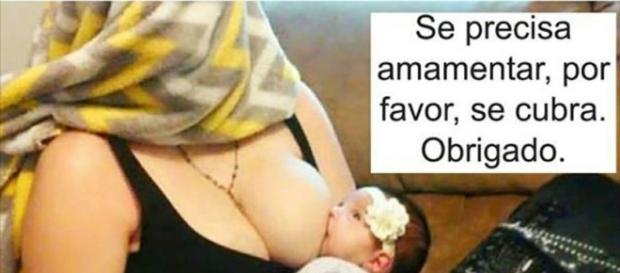 Mulher cobrindo o rosto ao amamentar seu filho. Mulher cobrindo o rosto ao amamentar seu filho.