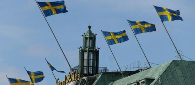 Bandiere svedesi, croce scandinava gialla su sfondo blu Bandiere svedesi, croce scandinava gialla su sfondo blu