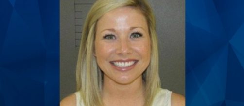 Teacher smiles for mugshot after arrest for sexual contact with ... - crimeonline.com