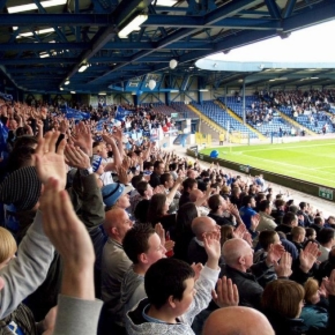 Behind the goal, the traditional place for noies to be made at club football matches - neontommy.com