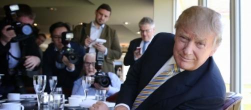 A smug Trump in front of the Press / Photo by theimaginativeconservative.org via Blasting News library