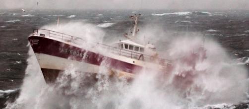 Fishing vessel caught in a storm. Royal Navy/Wikimedia