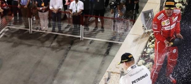 Sebastian Vettel sprays the rose water after winning in Bahrain for Ferrari. (Source: BBC Sport) Sebastian Vettel sprays the rose water after winning in Bahrain for Ferrari. (Source: BBC Sport)