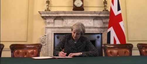 Theresa May heralds momentous day for Britain as she signs ... - thesun.co.uk