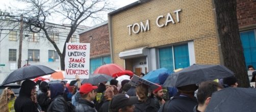 Immigration Inquiry Draws Protest at Tom Cat Bakery squib | New / Photo by squibs.org via Blasting News library