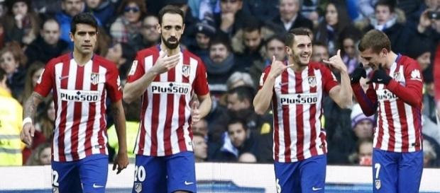 Augusto, Juanfran, Koke y Godín celebran un gol Augusto, Juanfran, Koke y Godín celebran un gol