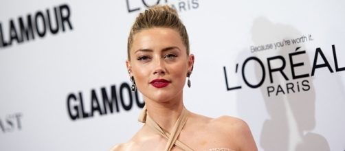 Amber Heard is keeping herself busy with "Aquaman" following her divorce with Johnny Depp. (via Valerie Macon/AFP)