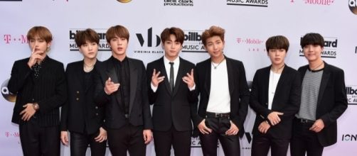 K-Pop band and Top Social Artist BTS pose for Billboard's Magenta Carpet. Photo via Billboard, billboard.com