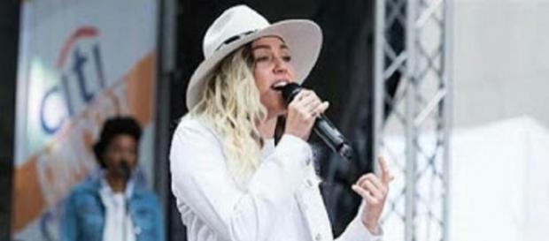 Miley Cyrus wears shorts, boots, and her Stetson and pours her heart into new songs on her "Today" performance.--personal screenshot edit Miley Cyrus wears shorts, boots, and her Stetson and pours her heart into new songs on her "Today" performance.--personal screenshot edit