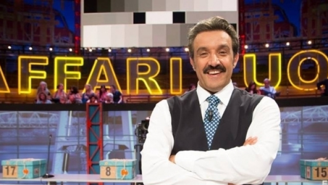 Flavio Insinna contro Ezio Greggio - gentevip.it